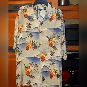 An Izod Rayon Tropical Floral Button-Up Shirt In A Size XXL.